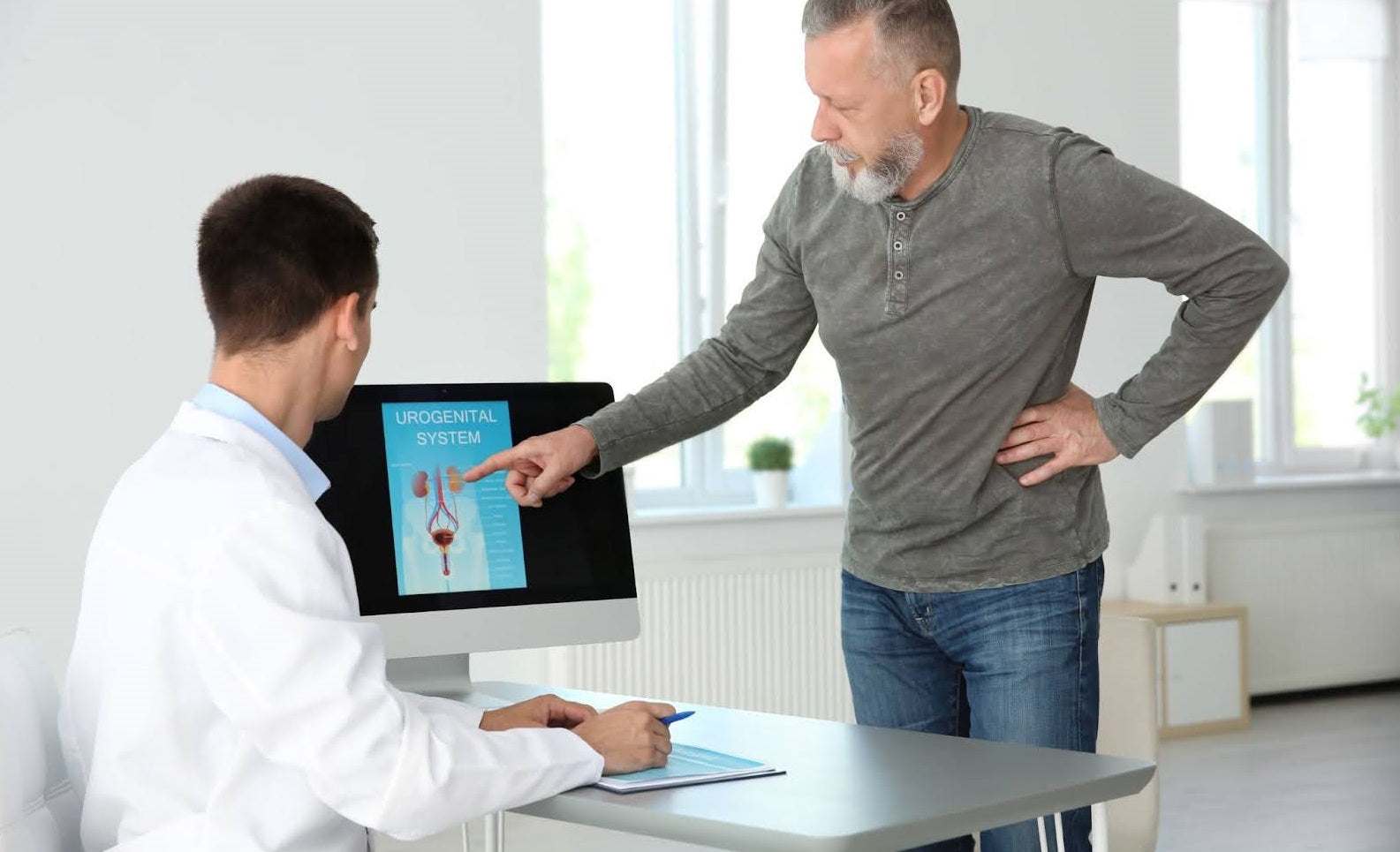 Man looking at prostate results with doctor