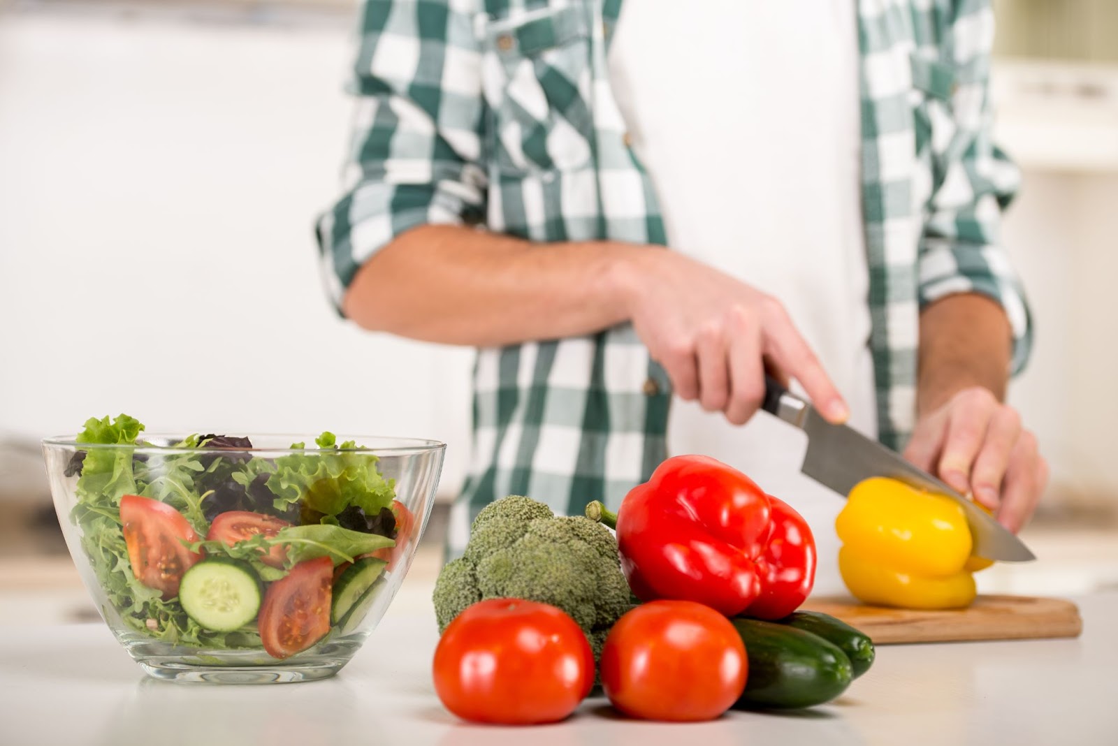 Man preparing a bowl of the best food for prostate health.