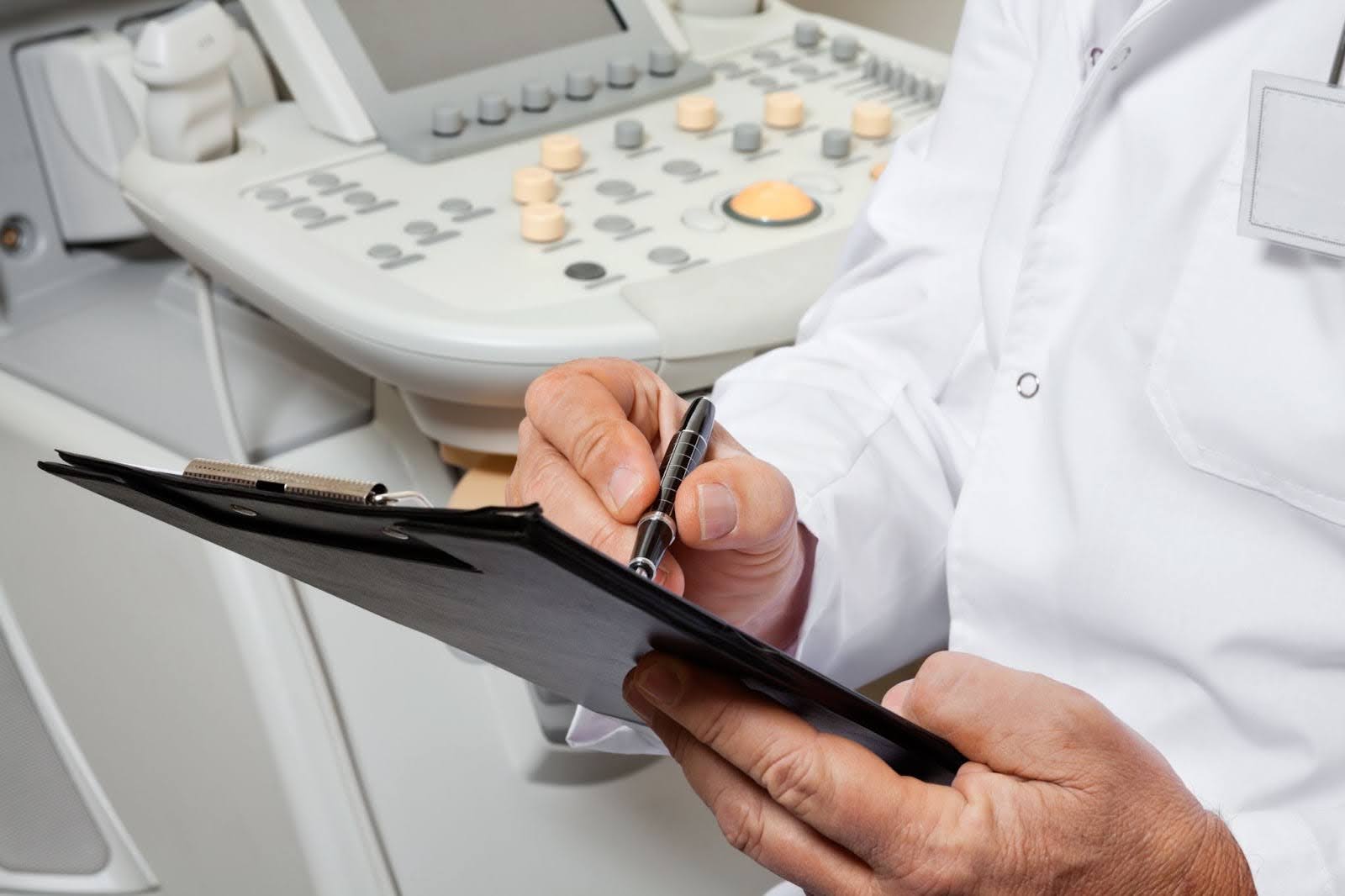 Doctor reviewing results from patient’s prostate ultrasound.
